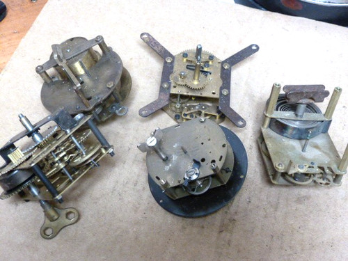 Small old clock movements - small,