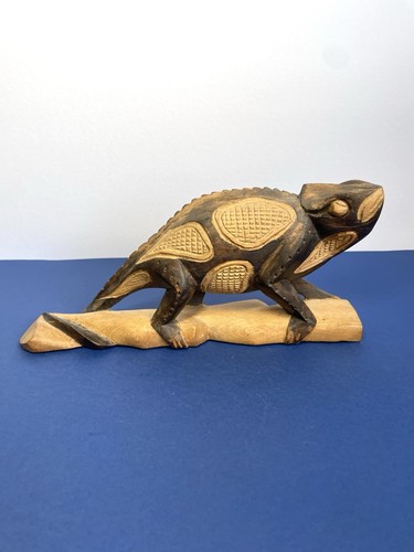 Hand carved wooden chameleon - hand,