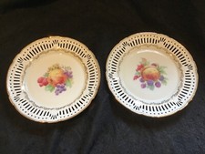 Two Antique Continental Reticulated Ribbon Plates with Fruit Decoration.