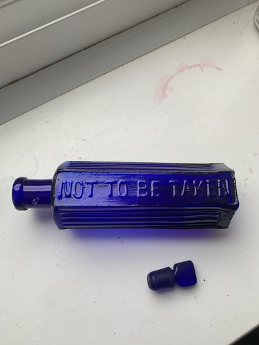 Cobalt blue poison bottle with - poison,