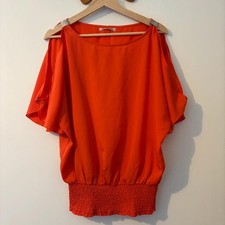 Orange cold shoulder top