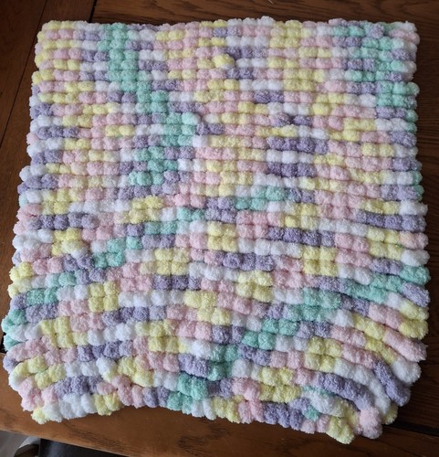 Hand knitted pompom blanket-