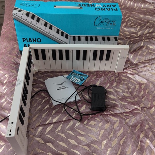 Carry key folding piano - on,