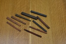 Ten Good Used Norton India 4" Slip Stones, Round, Tapered, Square etc.