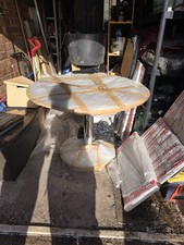 Solid round glass table with metal centre and solid glass base. Collection only.
