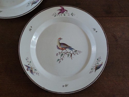 Two antique plates with - plates,