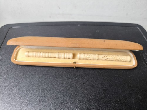 Two carved cow bone - carved,