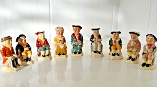 Nine small toby jugs - nine,