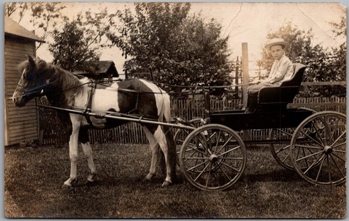 Postcard young boy straw - in,