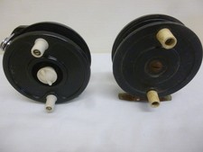 2 hard plastic fly reels