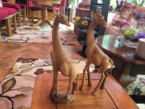 Hand carved wooden giraffe - hand,