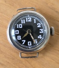 Antique WW1 trench watch . Silver. black dial. N/W