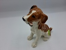BESWICK MODEL OF A DOG  WITH A BONE "GNAWING  "