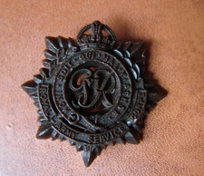 WW2 Plastic Economy RASC cap badge with two blades - Royal Army Service Corps
