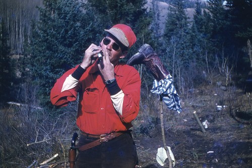 Man wearing holstered pistol - man,