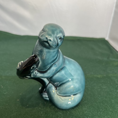 Poole pottery otter with - poole, fish