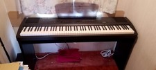 Kurzweil digital piano,  good overall condition, including stand. Many voices.