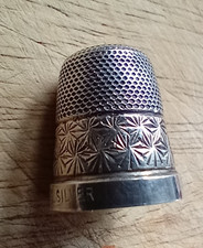 Vintage solid silver thimble of an ornate design.