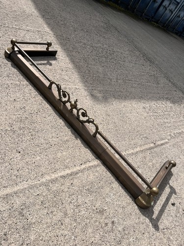 Antique brass fire fender art