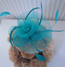 Jade green fascinator. Sinamay