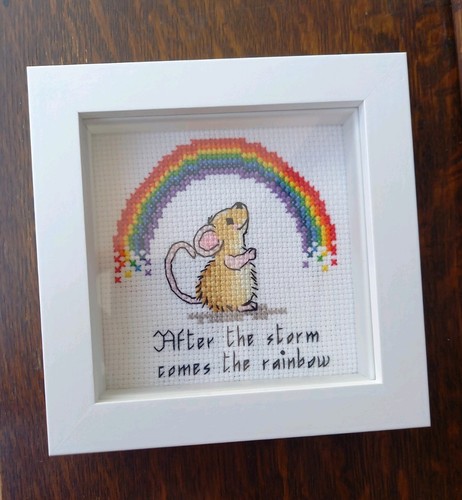 Completed cross stitch framed