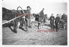 Russians transporting wood to