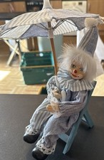 Vintage Porcelain Clown Doll On Deck Chair Holding an Umbrella 
