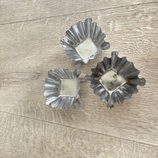 Three mini square tart tin or canapé moulds with crimped edges