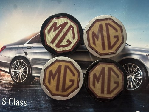 Four genuine wheel centre - mg,