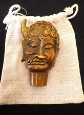 A bronze Buddha head with the