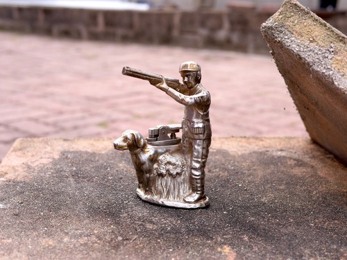 Hunter and dog figural table - and,