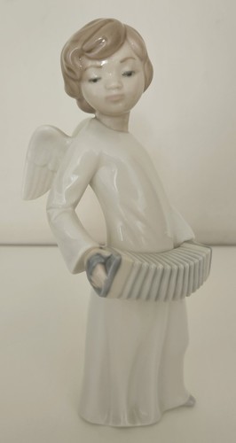 Nao lladro angel playing - by,