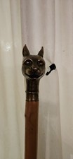 A Waking/hiking Stick With Metal Animal Head Top And Over 4ft Tall