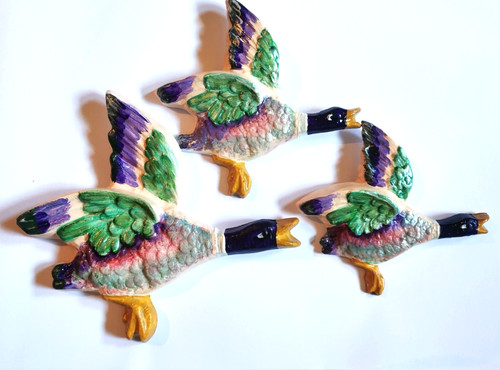 Flying ducks plaster wall