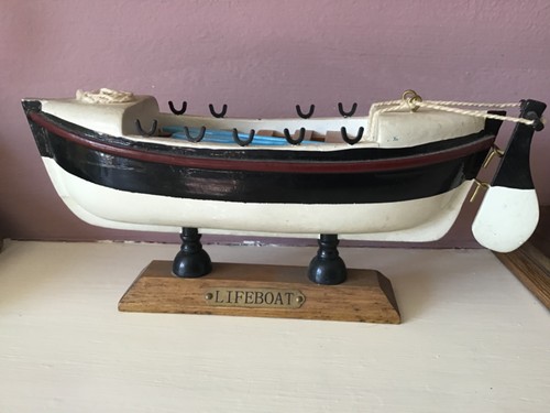 Hand built wooden lifeboat - hand,