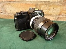 a Nice Vintage Nikon FM 35MM SLR camera 1:1.2.8 135mm lens