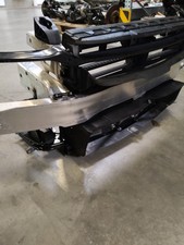 Radiator grille support for