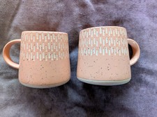 Pair Of Cermetric Joyee Mugs
