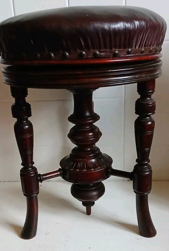 Antique mahogany swivel piano