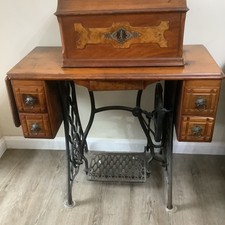 Vintage Sewing Machine On Cast Iron Base With Foot Pedal And Wooden Cover