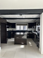 Brown Gloss Kitchen With Island And Granite Worktop