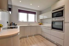 Fitted Kitchen with Integrated Appliances and Quartz Worktops White Gloss