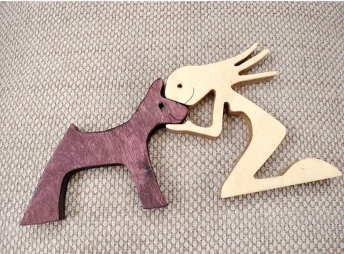 Wooden woman dog carving - woman,