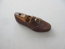 Vintage cobblers small unfinished leather shoe on wooden last. Apprentice piece?
