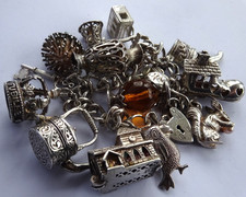 Vintage chunky solid silver charm bracelet&many curious silver charms inc moving