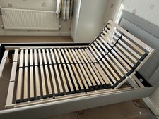 Bed frame with motorised reclining and leg raising.