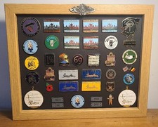 34 Enamel Motorcycle Rally Plaques & Badges in Frame