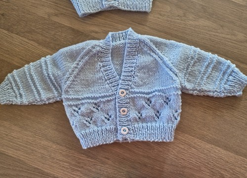 New baby boy hand - knitted, blue