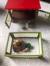 schleich rabbit hutch with 3 rabbits and a hamster. good condition.