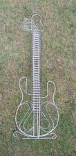 Chrome Stand Up Guitar Shaped C.D Rack